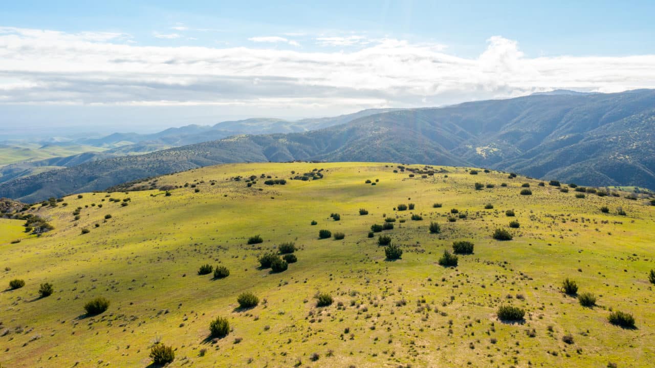 Rolling ranch land at sunset
